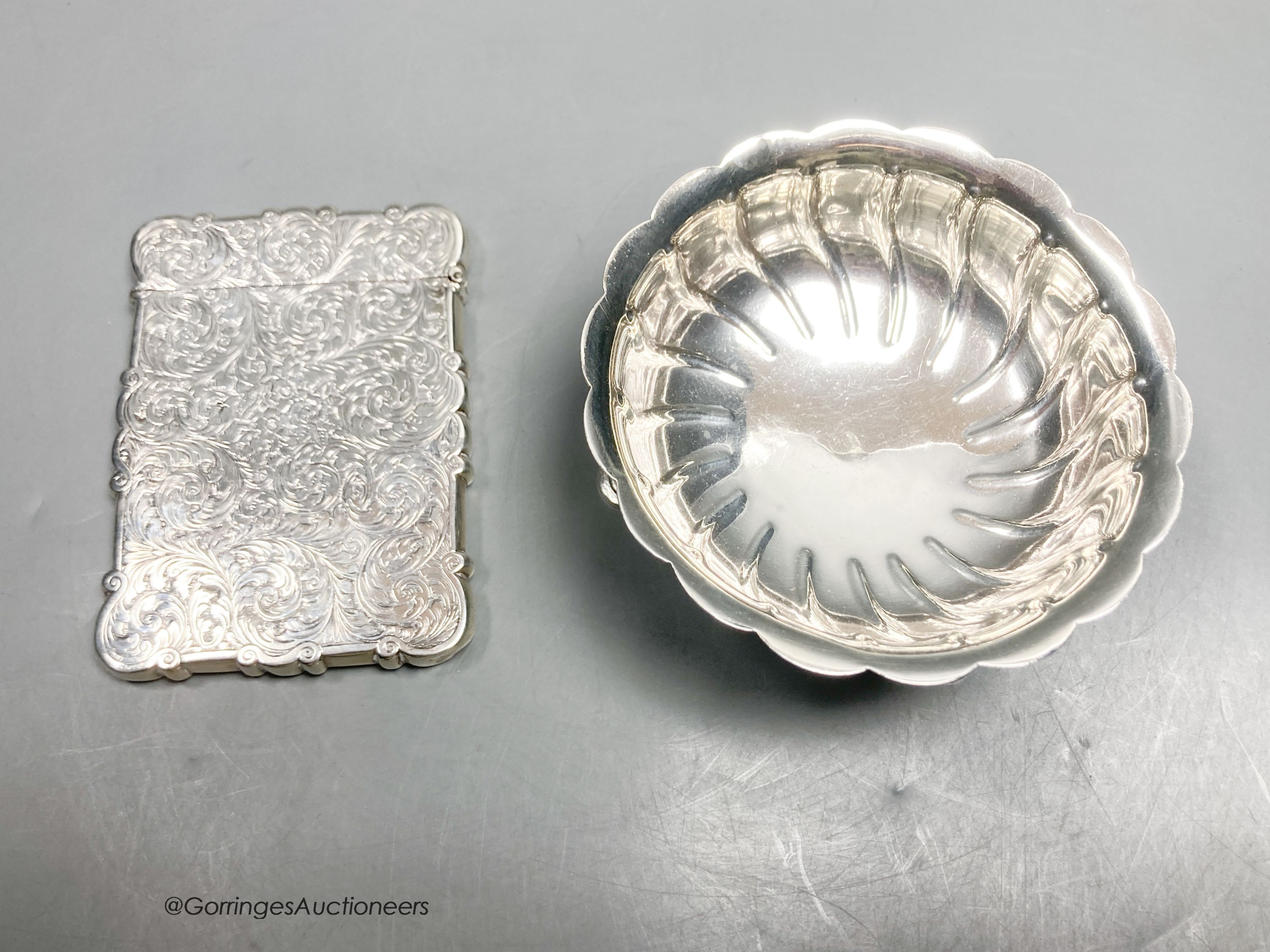 A Victorian engraved silver card case, Edward Smith, Birmingham, 1850, 10.4cm, together with a late Victorian silver sugar bowl, London, 1891, gross 197 grams.